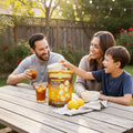 Enjoying Drizzilicious Lemon Cake Bites, vegan lemon cake snacks, as a family at a sunny outdoor picnic.