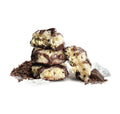 Jennies USDA Organic Coconut, Cacao Nibs and Dark Chocolate Bites stacked, featuring organic coconut cacao chocolate bites.