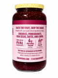 Cherry Pomegranate Superfood Fruit Spread jar with natural ingredients and nutrition facts on label.